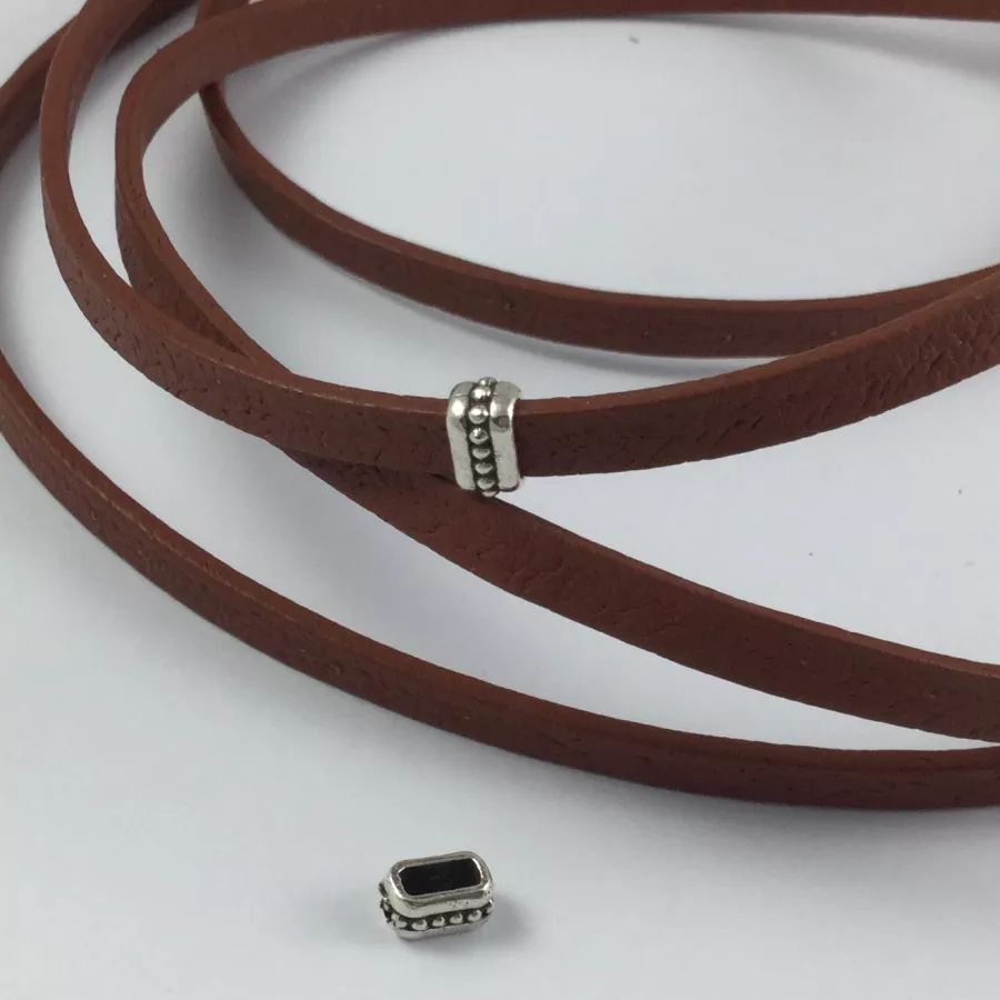 20 Passants 5mm en étain avec motif