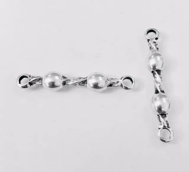 Intercalaire tige avec 2 boules et 2 anneaux 