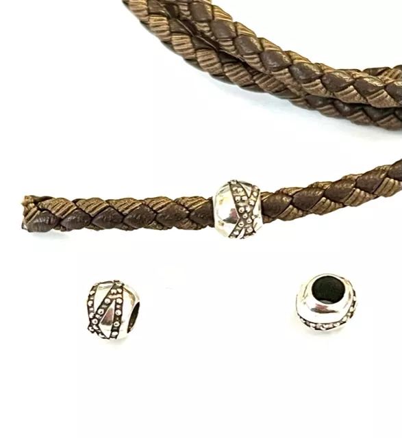 Perles avec motif diam 7mm trou 4.2mm